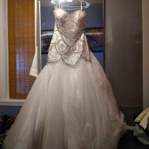 Brand new wedding dress. Designer moonlight color Ivory size 12